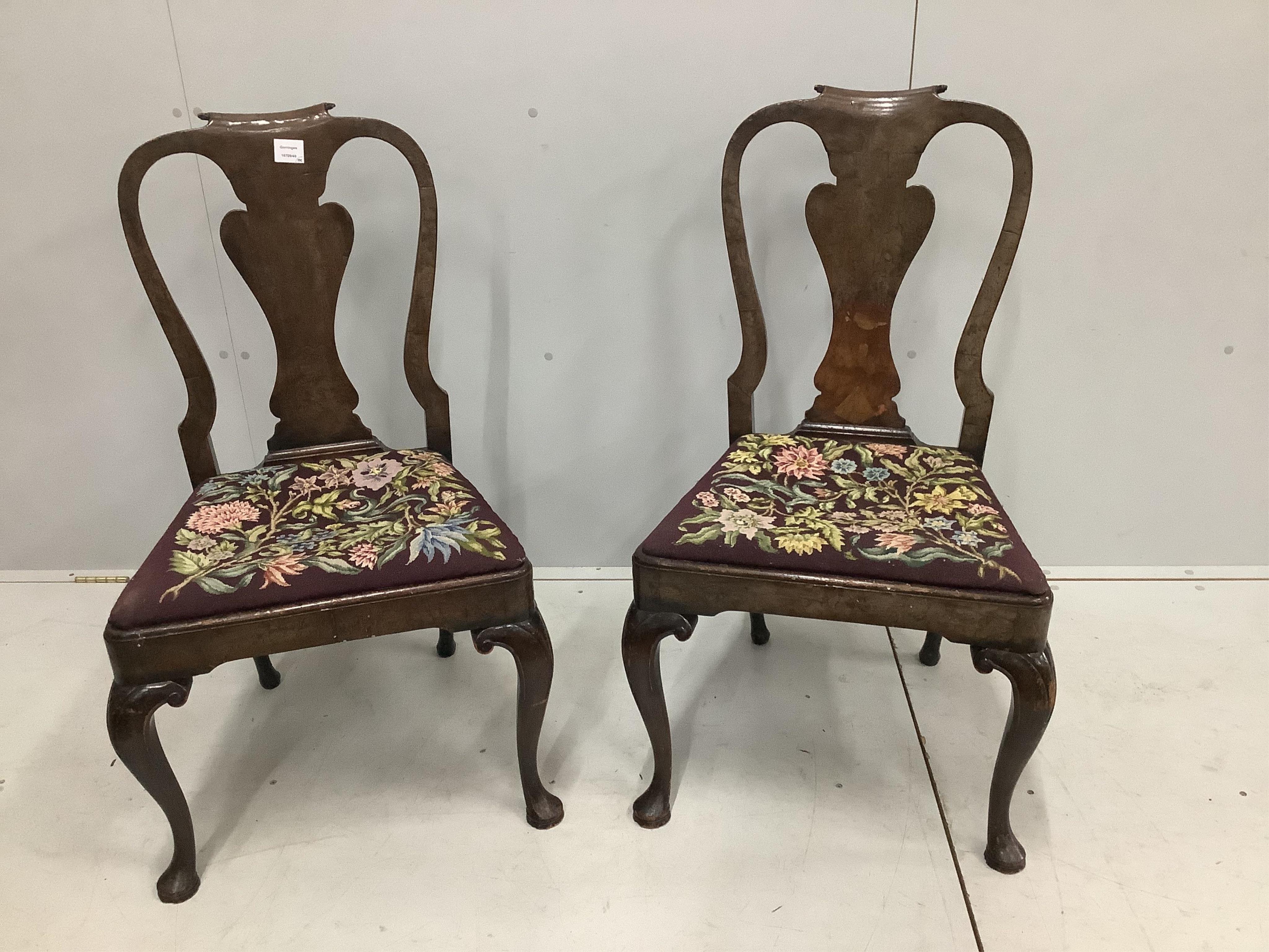 A pair of Queen Anne style walnut dining chairs, height 97cm. Condition - poor